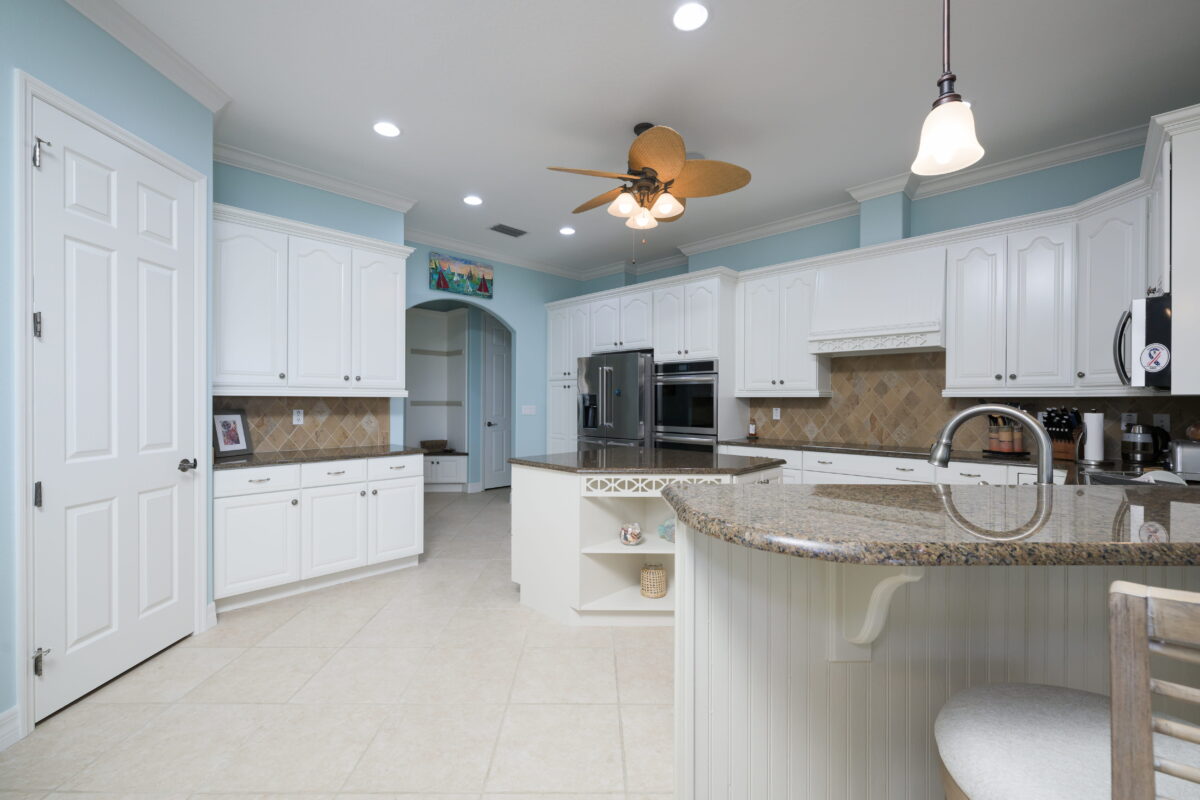 Modern coastal kitchen transformation in Turnbull Bay, New Smyrna Beach with bright open layout